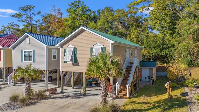 view of front of home with a carport