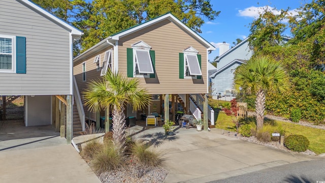 raised beach house with a carport