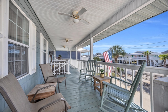 310 34th Ave N, North Myrtle Beach, SC 29582 - porch with a ceiling fan and a residential view