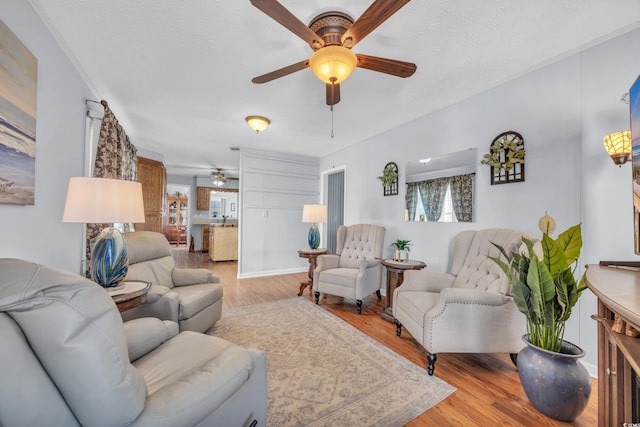 310 34th Ave N, North Myrtle Beach, SC 29582 - living area with a ceiling fan and light wood-style floors