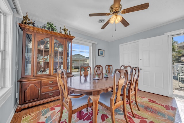 310 34th Ave N, North Myrtle Beach, SC 29582 - dining area featuring light wood-style flooring, plenty of natural light, ornamental molding, and ceiling fan