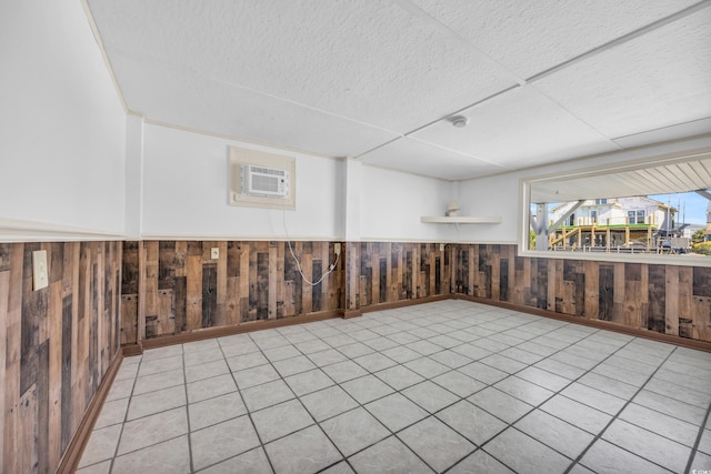 310 34th Ave N, North Myrtle Beach, SC 29582 - below grade area with wainscoting, wooden walls, and a wall unit AC