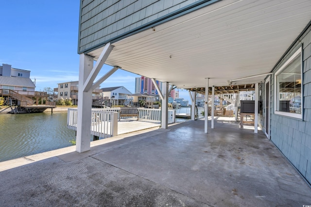 view of patio / terrace with a water view