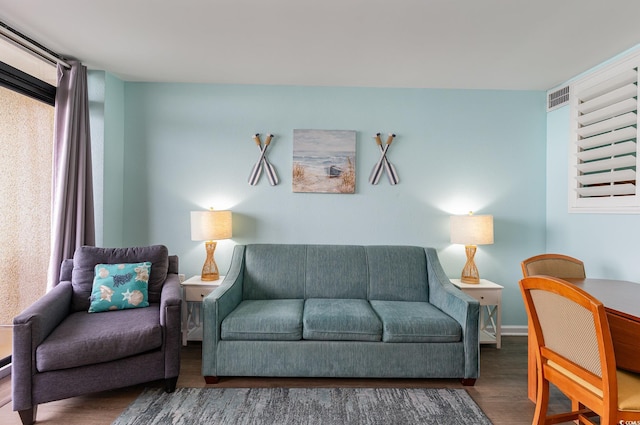 living room featuring dark wood-type flooring