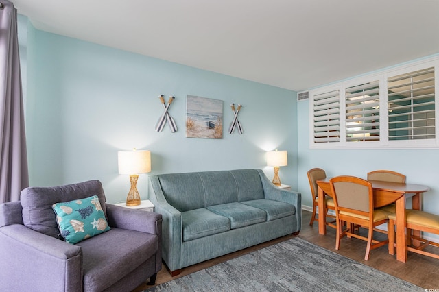 living room featuring dark wood-type flooring