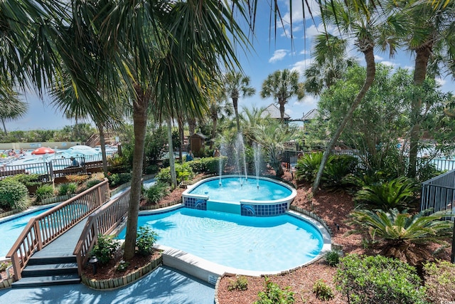 view of pool featuring pool water feature