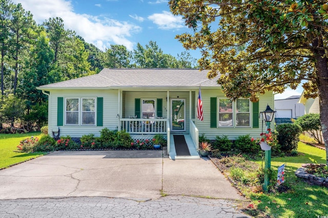 view of front of property with a porch and a front yard