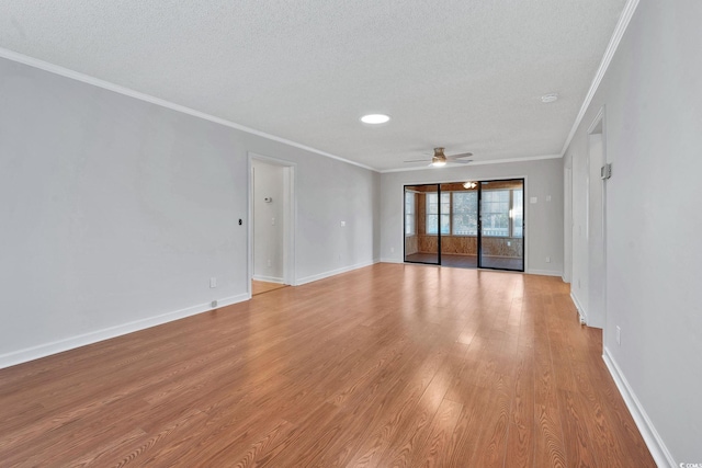 unfurnished room with ceiling fan, ornamental molding, a textured ceiling, and light wood-type flooring