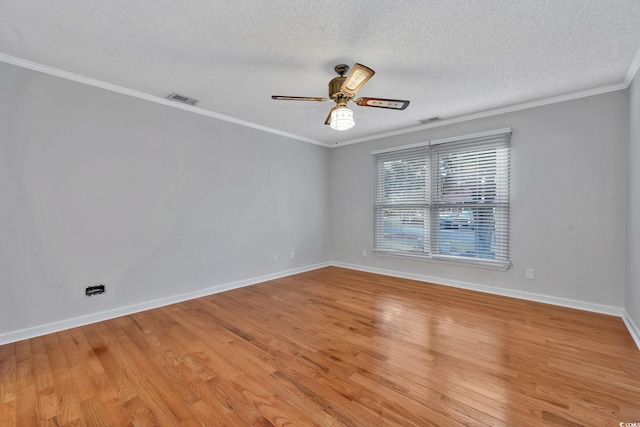 spare room featuring crown molding, ceiling fan, light hardwood / wood-style floors, and a textured ceiling