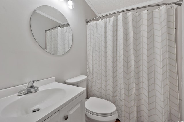 bathroom featuring walk in shower, a textured ceiling, toilet, vanity, and ornamental molding