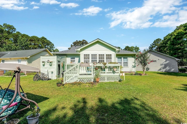 back of house with a yard and a wooden deck