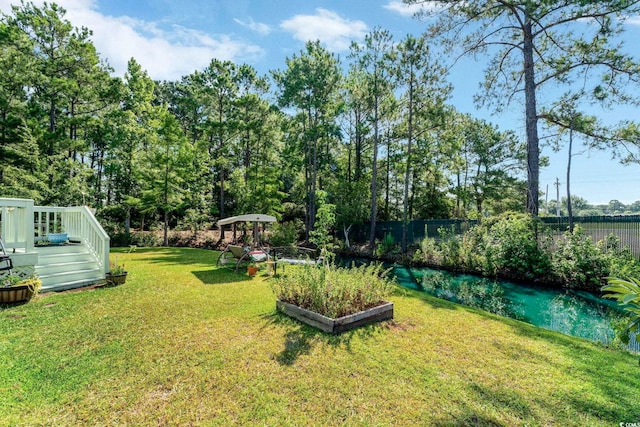 view of yard with a wooden deck