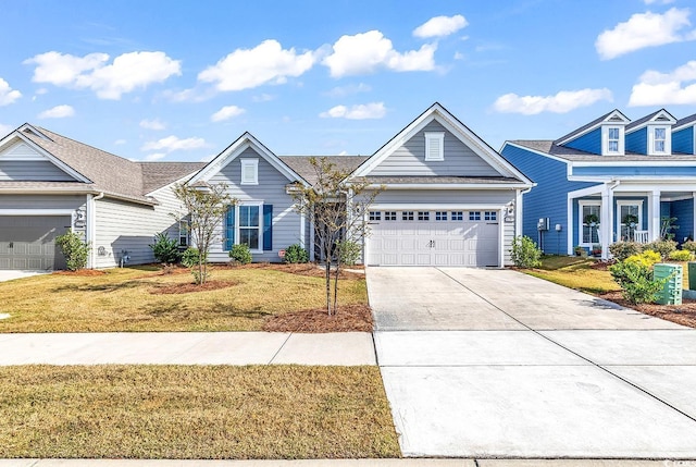 view of front of house with a garage and a front yard