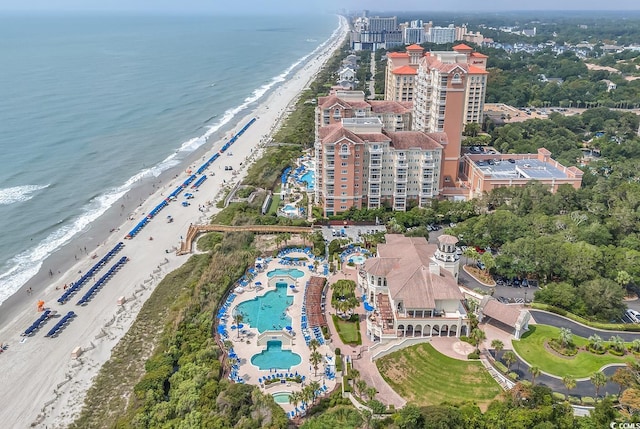 aerial view with a water view and a view of the beach