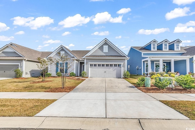 view of front of home with a garage and a front lawn