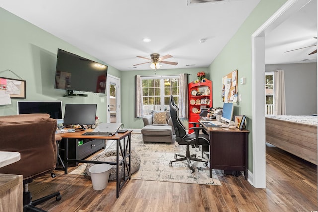 home office featuring hardwood / wood-style flooring and ceiling fan