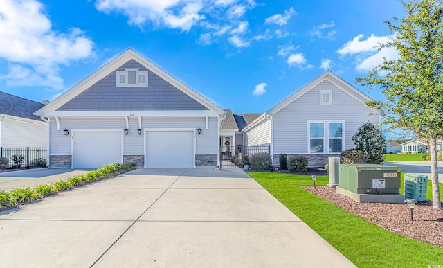 view of front of property featuring a garage and a front lawn