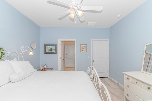 bedroom featuring ceiling fan and light colored carpet