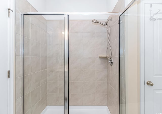 bathroom featuring an enclosed shower