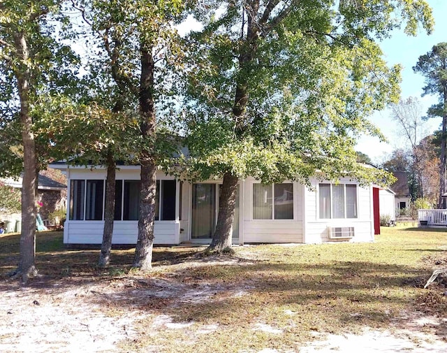 obstructed view of property with a front yard