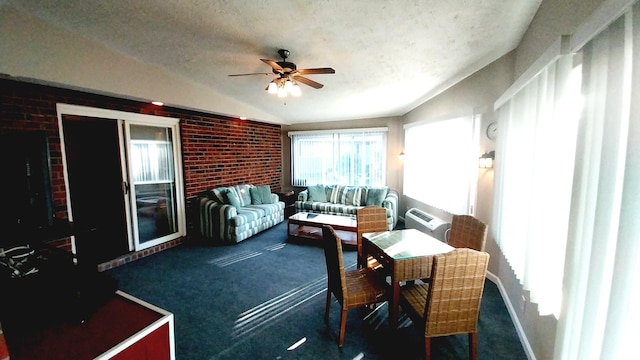 sunroom / solarium featuring ceiling fan and vaulted ceiling