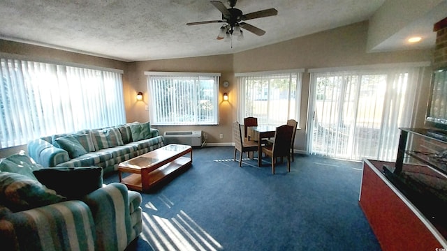 carpeted living room featuring ceiling fan, lofted ceiling, a textured ceiling, and a wall unit AC