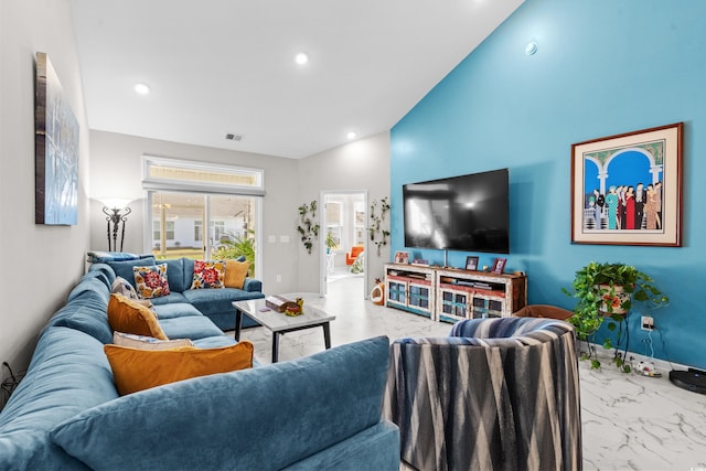 living room featuring lofted ceiling