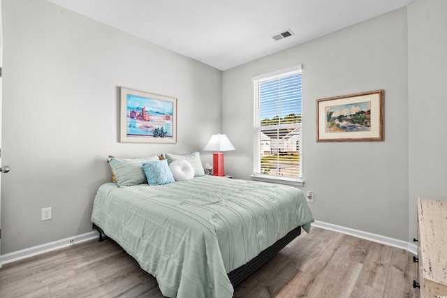 bedroom with light hardwood / wood-style flooring