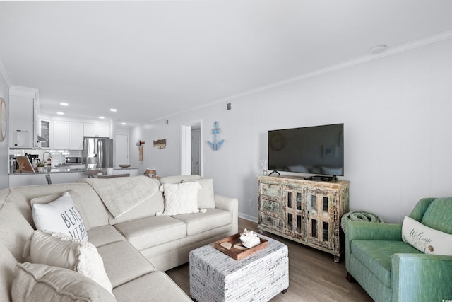 living room with ornamental molding and hardwood / wood-style flooring