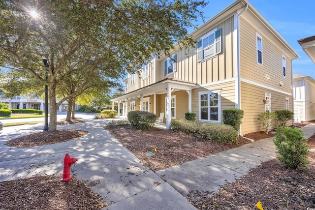 townhome / multi-family property with covered porch