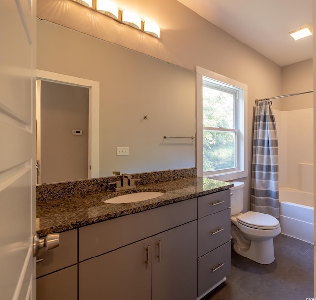 full bathroom with tile patterned floors, toilet, vanity, and shower / bathtub combination with curtain