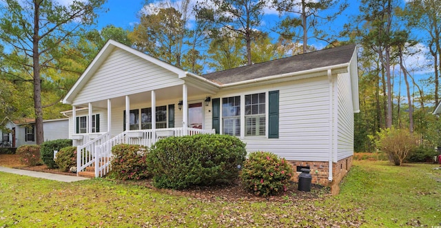 view of front of house featuring a front yard, covered porch, and crawl space