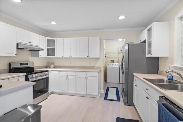 kitchen featuring under cabinet range hood, a sink, white cabinets, appliances with stainless steel finishes, and crown molding