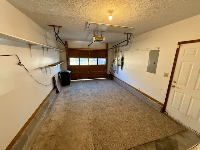 garage with electric panel and a garage door opener