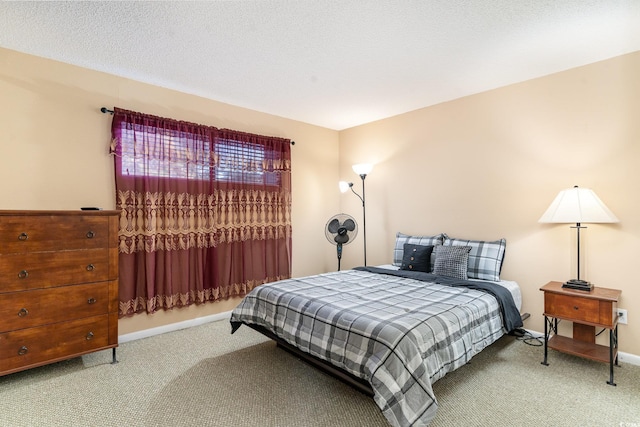 carpeted bedroom featuring a textured ceiling