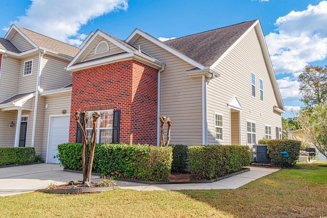 view of property exterior featuring a lawn and a garage