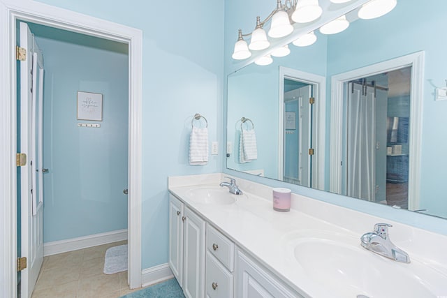 bathroom featuring tile patterned floors and vanity