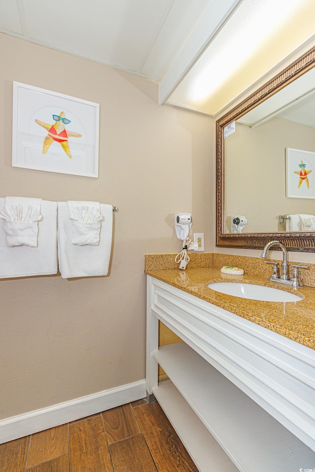 bathroom featuring vanity and wood-type flooring