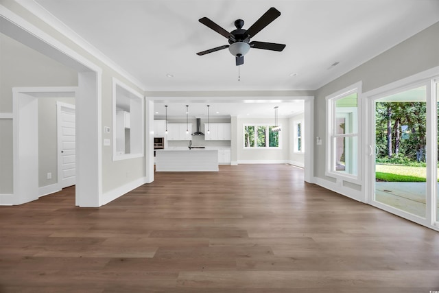 604 Mccown Dr, Conway, SC 29526 - unfurnished living room with ornamental molding, stairway, ceiling fan, dark wood-style flooring, and baseboards
