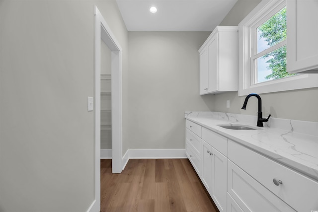 604 Mccown Dr, Conway, SC 29526 - kitchen with a sink, crown molding, stainless steel gas cooktop, white cabinetry, and wood finished floors