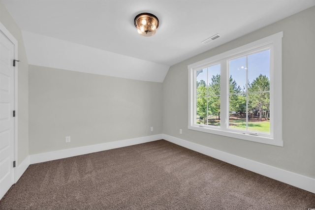 604 Mccown Dr, Conway, SC 29526 - bonus room with dark colored carpet, baseboards, and lofted ceiling