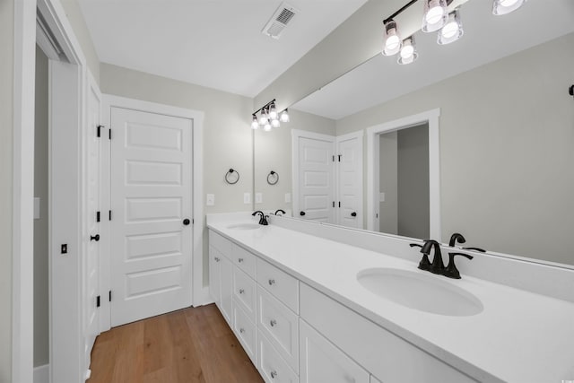 604 Mccown Dr, Conway, SC 29526 - bathroom with double vanity and wood finished floors