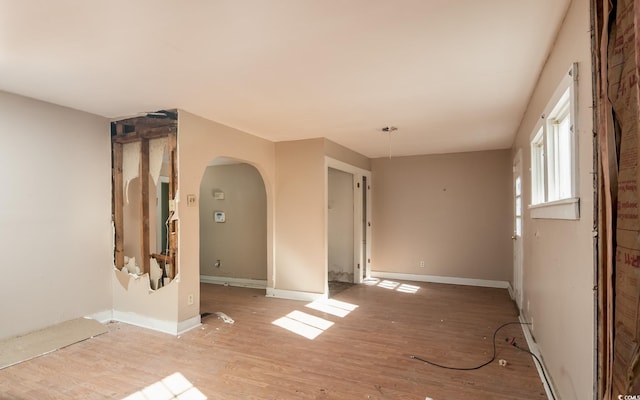 empty room with light hardwood / wood-style floors