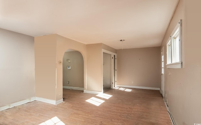 spare room featuring light hardwood / wood-style flooring