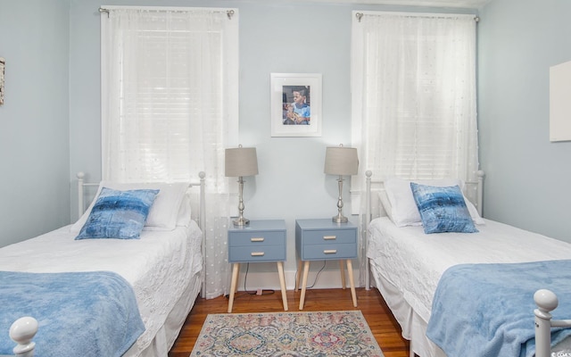 bedroom featuring dark wood-type flooring