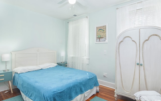 bedroom featuring dark hardwood / wood-style flooring and ceiling fan