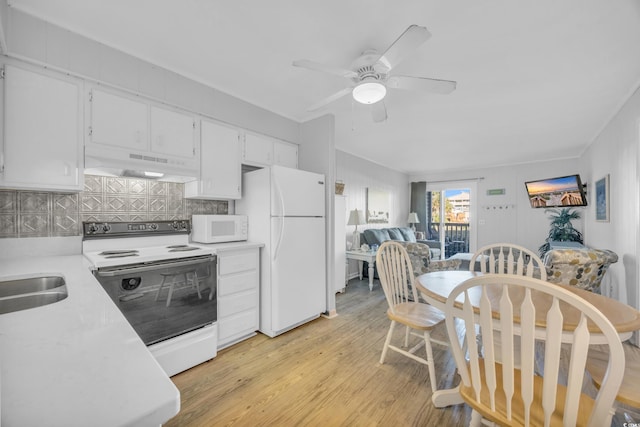 kitchen featuring decorative backsplash, white cabinets, white appliances, and custom exhaust hood