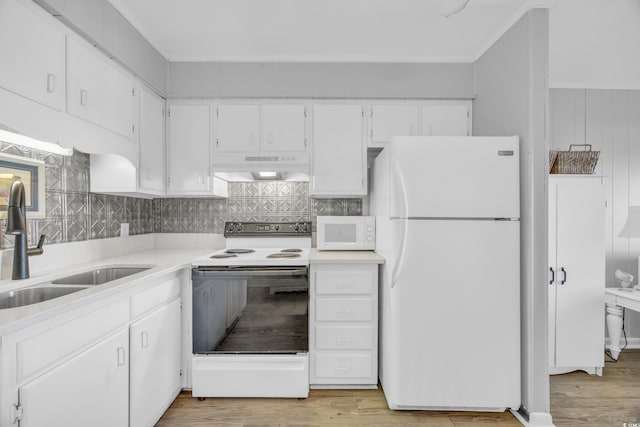 kitchen with decorative backsplash, white appliances, sink, light hardwood / wood-style flooring, and white cabinets