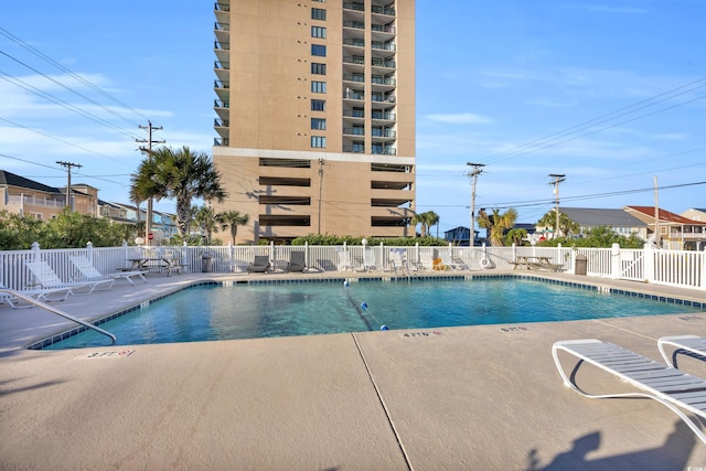 view of swimming pool featuring a patio