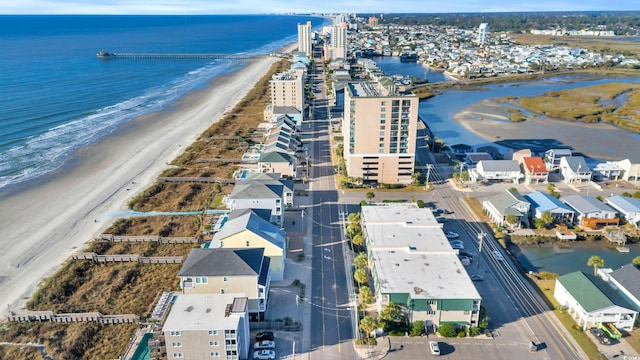 bird's eye view with a water view and a view of the beach